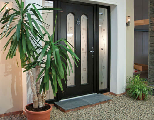Partially glazed front door with plant to the side