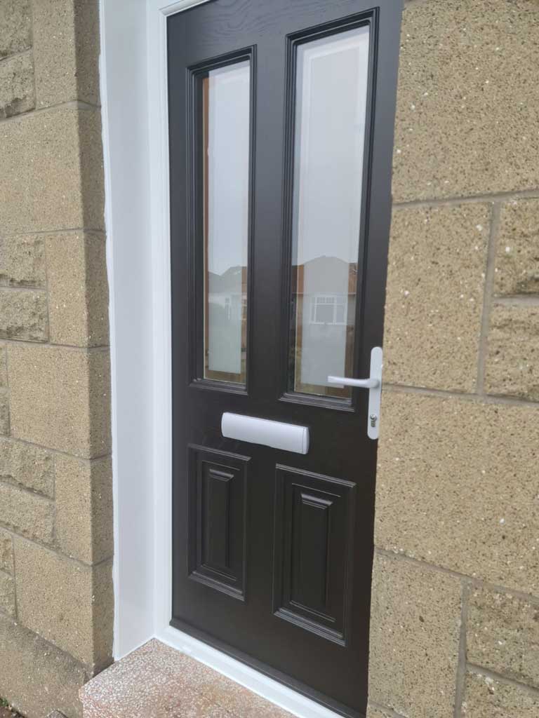 Black composite door with two upper glass panes
